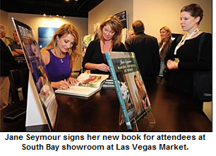 Jane Seymour signs her new book for attendees at South Bay showroom at Las Vegas Market.