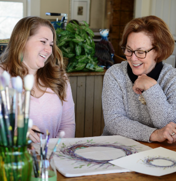 Golden Hill Studios founder Bette Hestle (right) and Sarah Hurst discuss a new design in their upstate New York facility.