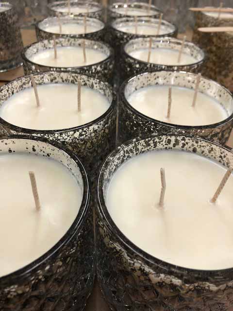 All natural Soy Candles from The SOi Company in Modesto California are ready for packaging.