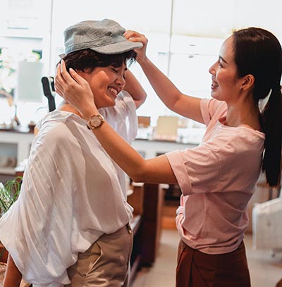 Shopper Trying on Hat